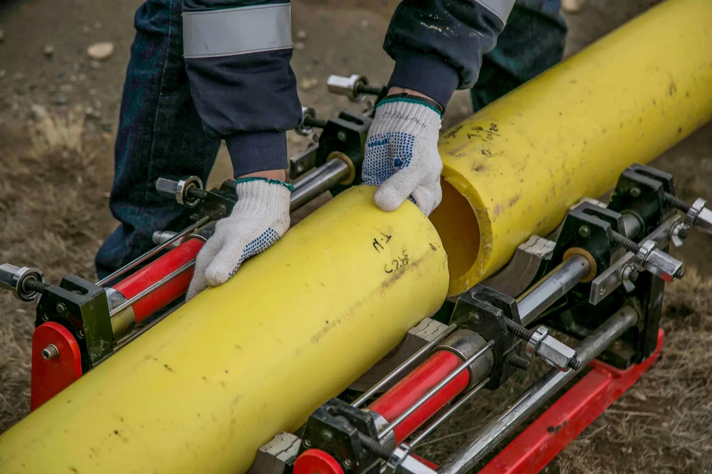 Field crew aligning pipe sections